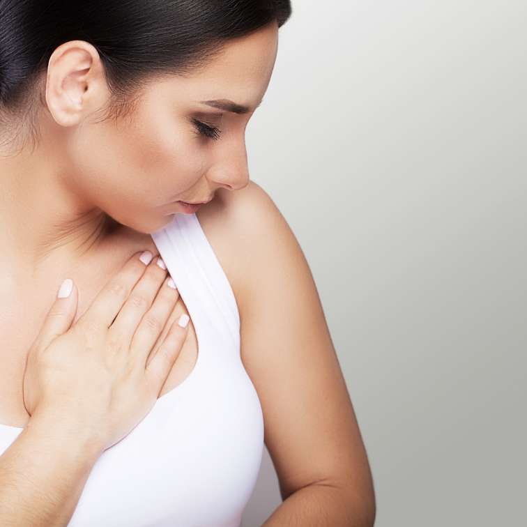 Why do my breasts feel sore before my period?